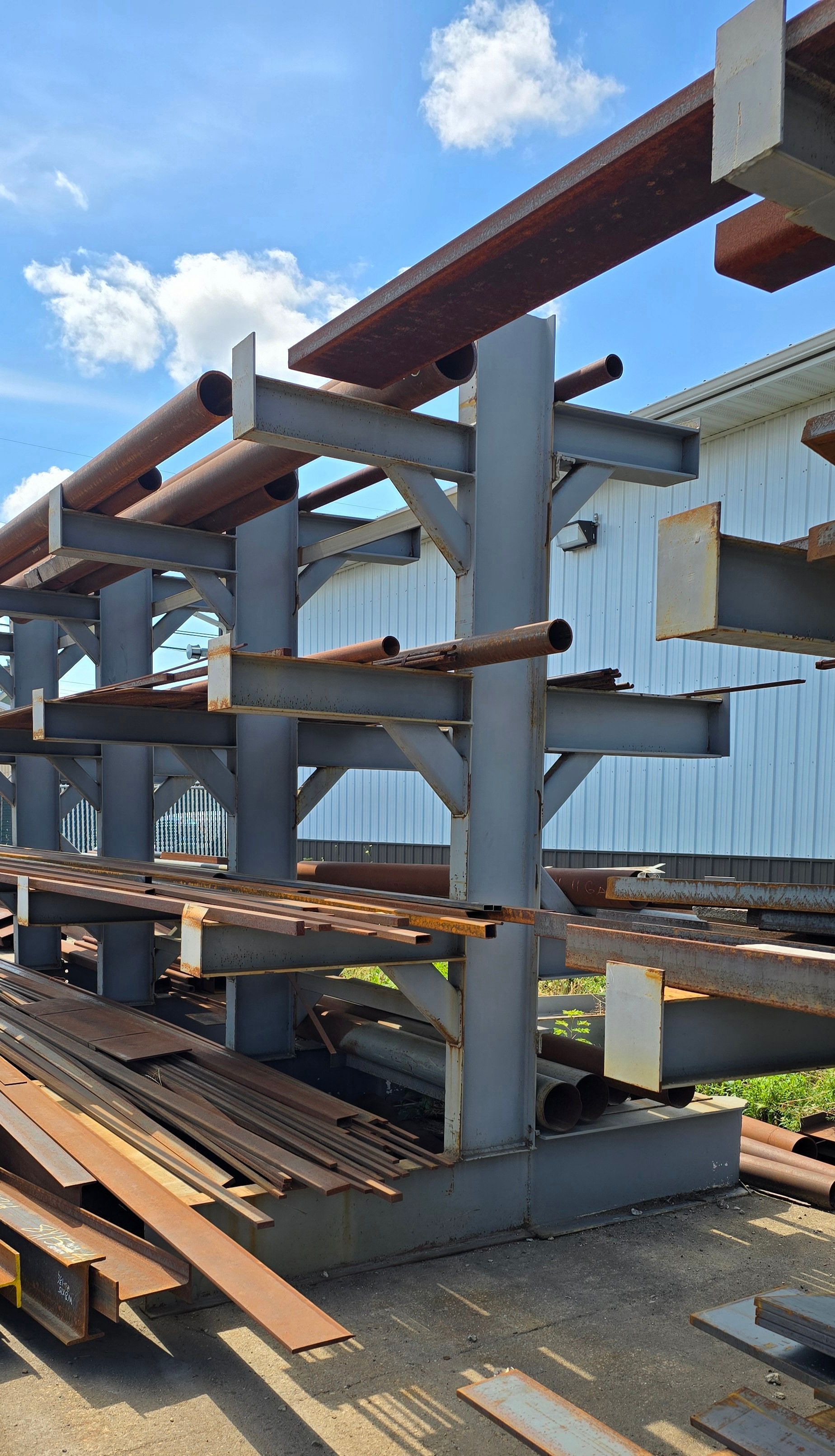 A warehouse filled with lots of metal beams and pipes.