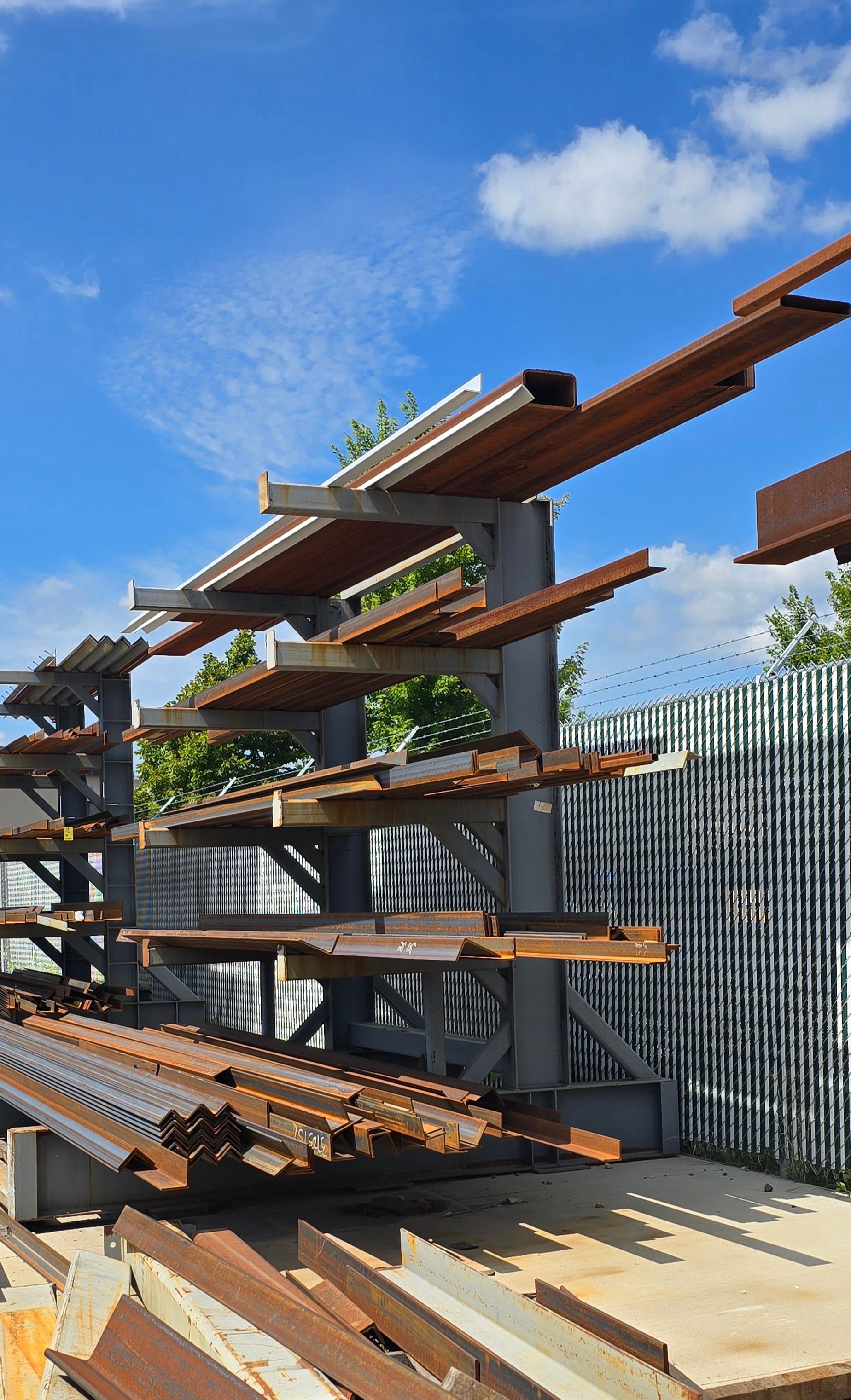 A bunch of metal pieces are stacked on top of each other on a rack.