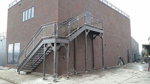 A building with stairs on the side of it.