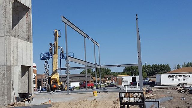 A construction site with a sign that says just dynamite