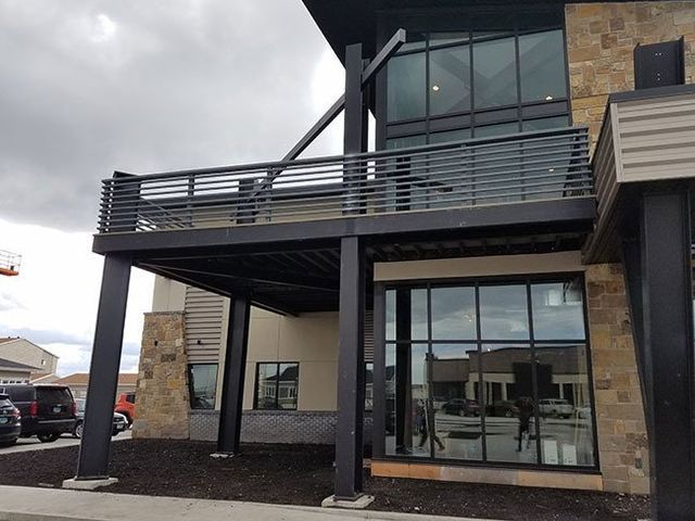A building with a balcony and a lot of windows