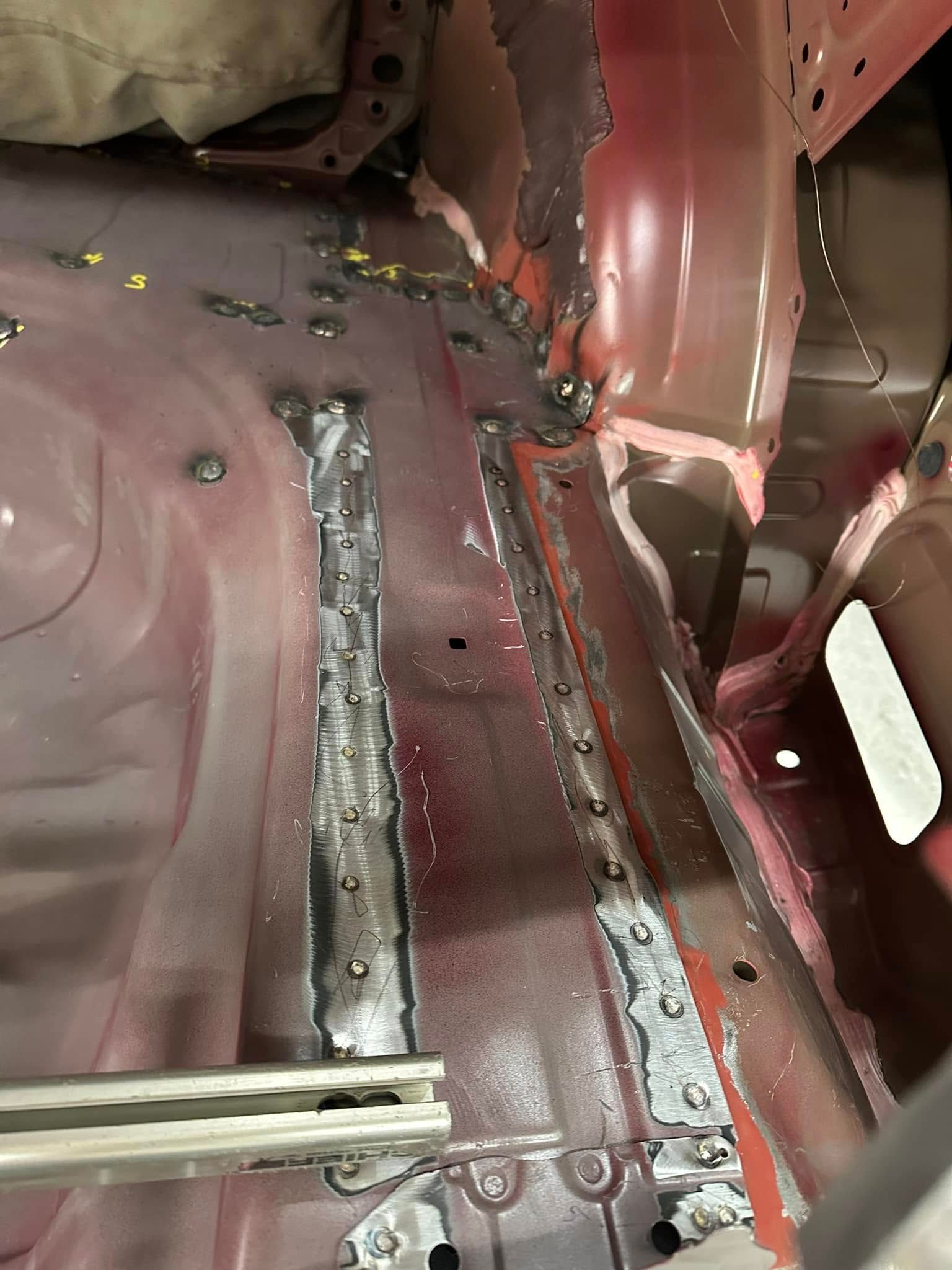 A close up of the inside of a red car.