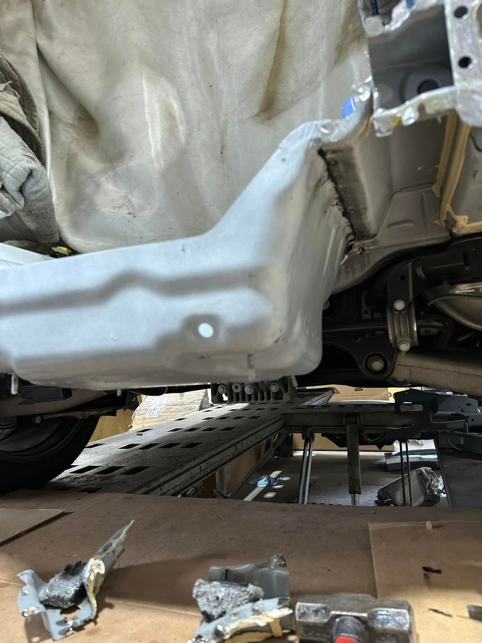 A car is sitting on top of a wooden table.