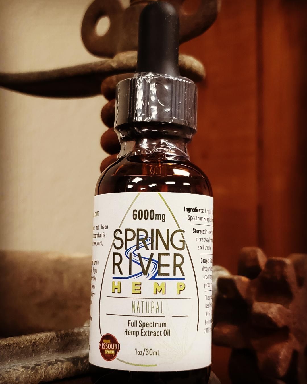 Bottle of Spring River Hemp oil with dropper.