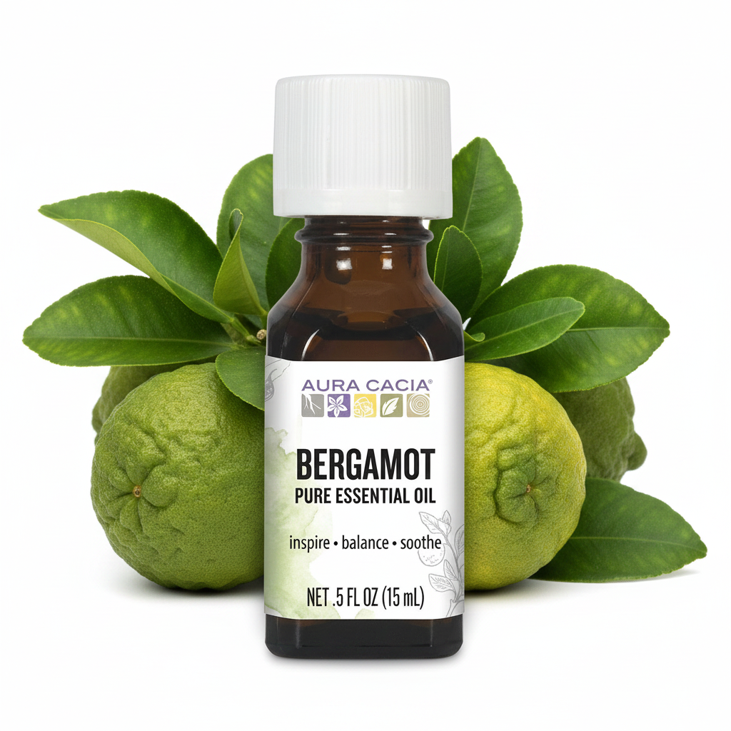 Bergamot pure essential oil bottle with green leaves and fruit behind it