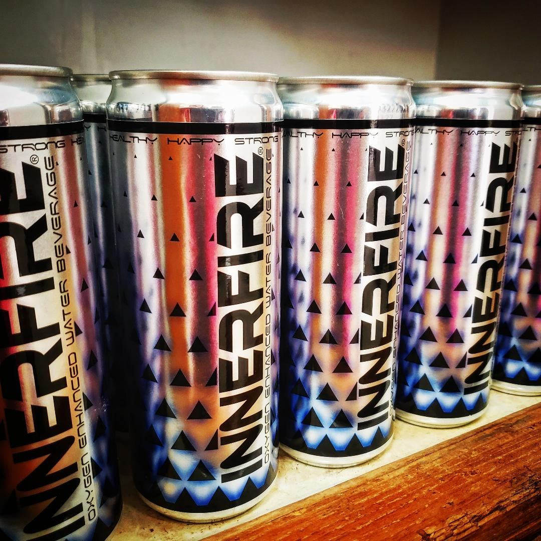 Inner Fire cans on a shelf with wooden trim