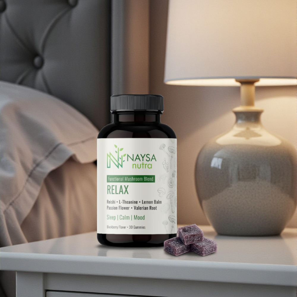 Naysa Naturals Relax essential oil bottle on bedside table beside lamp and crystals