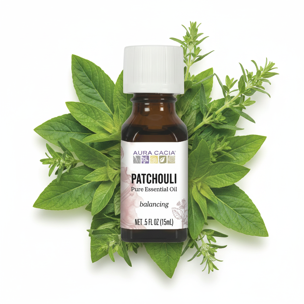 Patchouli essential oil bottle with green leaves on a white background