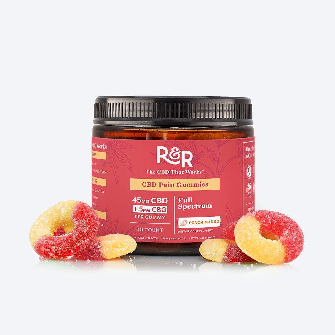 Jar of R&R CBD peach ring gummies, with three peach ring gummies in front.