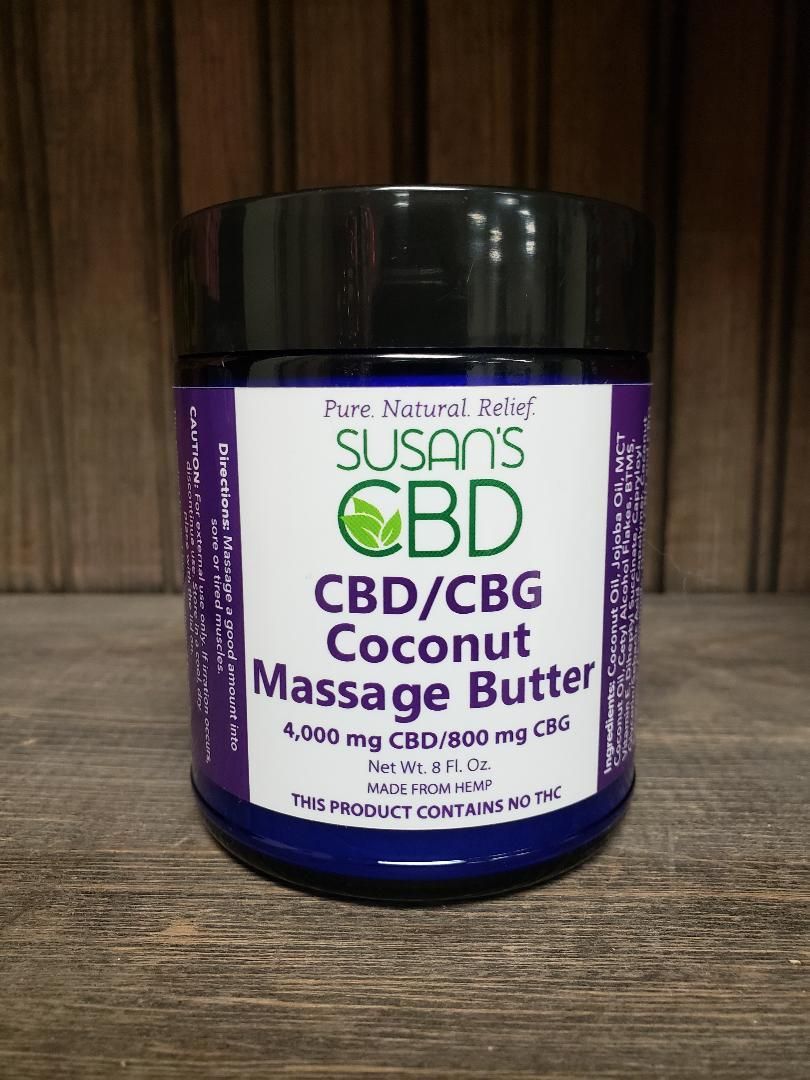 Jar of Susan's CBD coconut massage butter. Purple and white label, black lid.