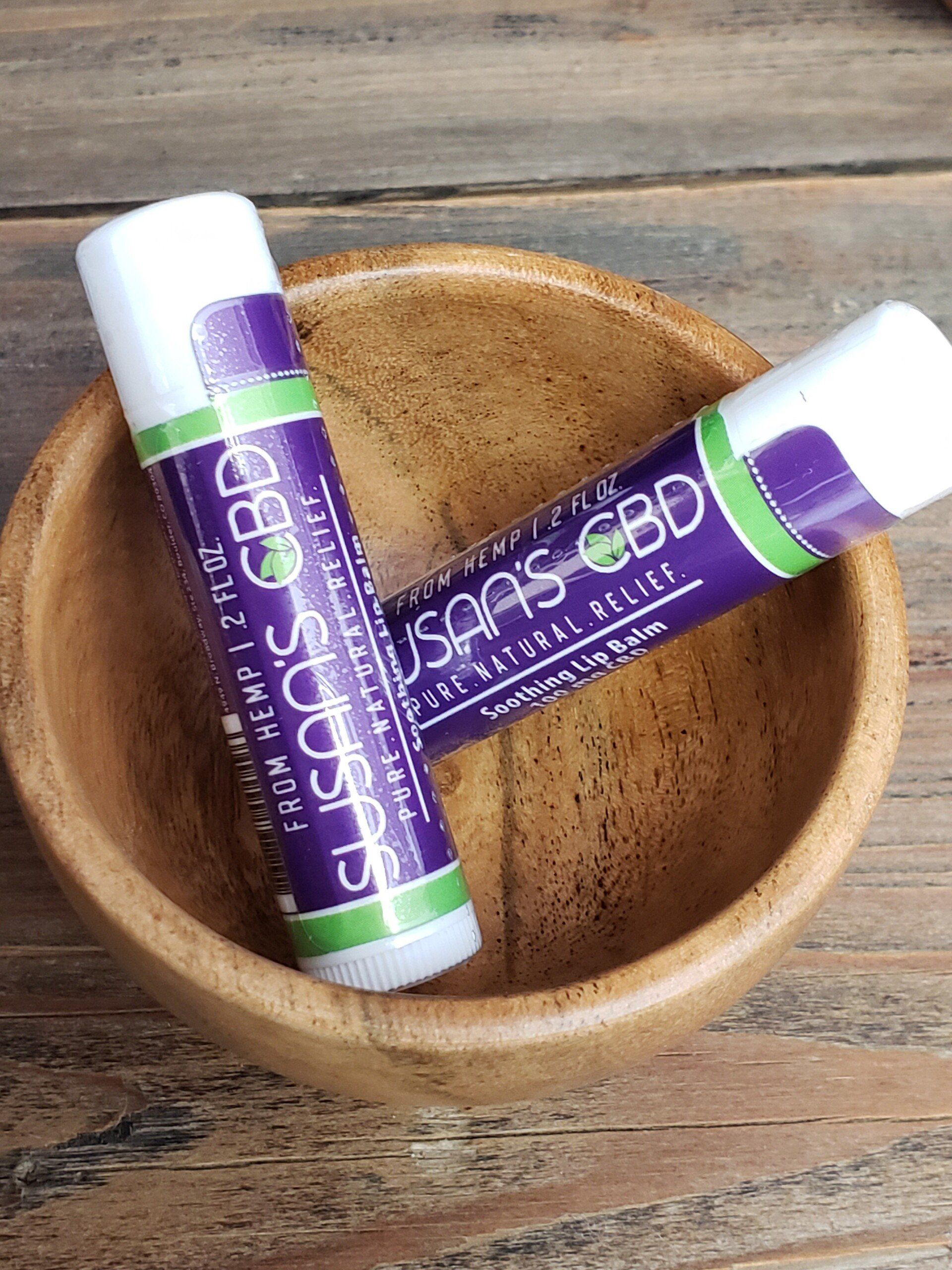 Two tubes of lip balm with 