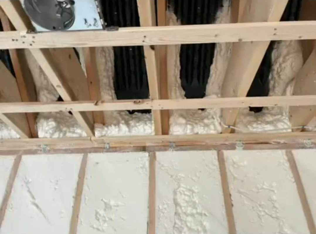 insulating material on wooden beams