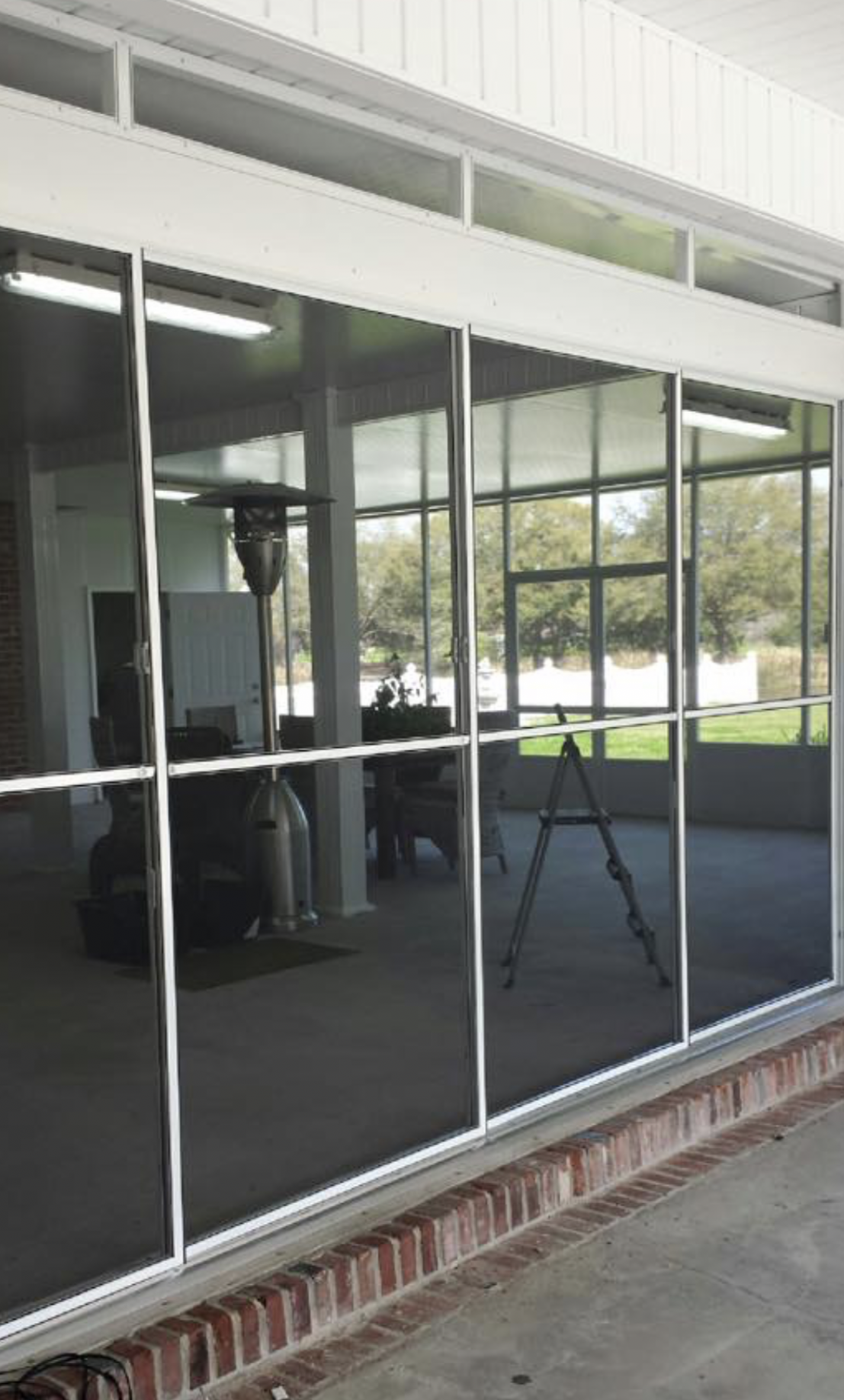 A building with a lot of windows and a ladder in the background.
