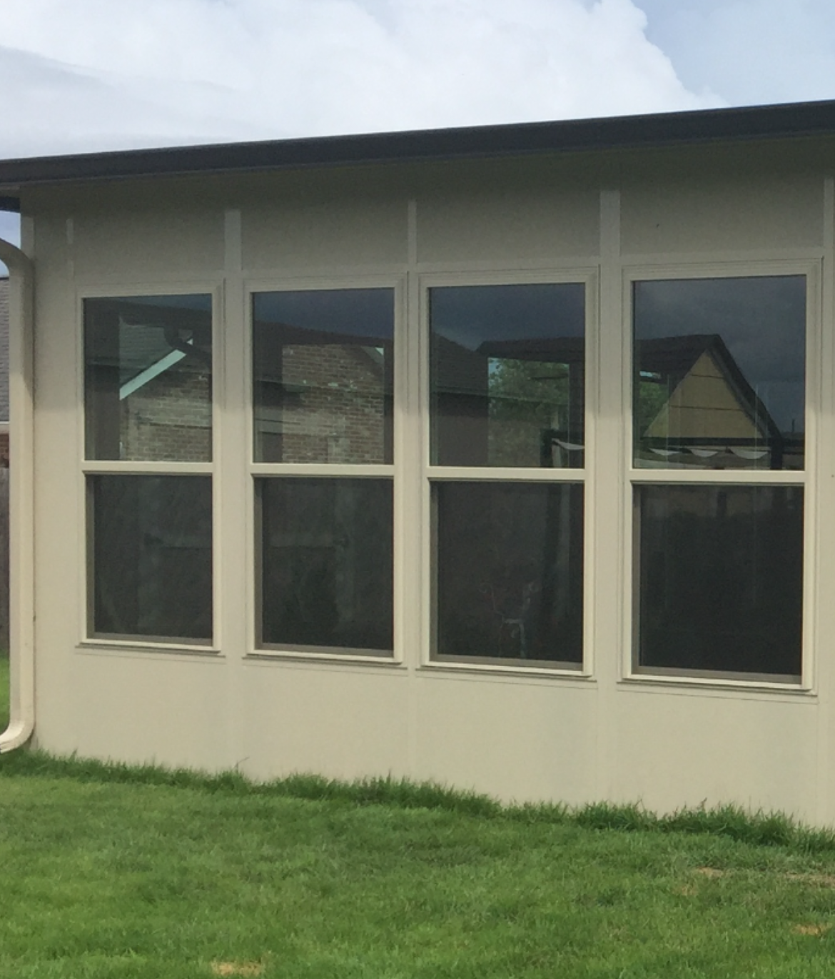 A house with a lot of windows on the side of it.