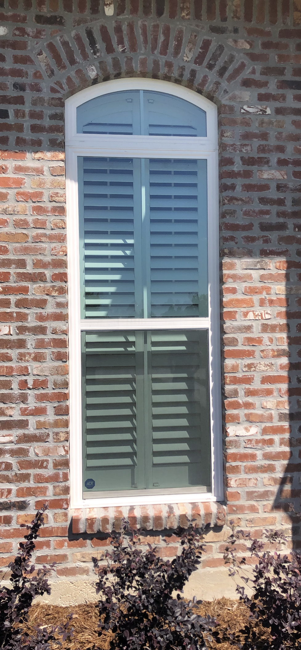 A brick building with a lot of windows on it.