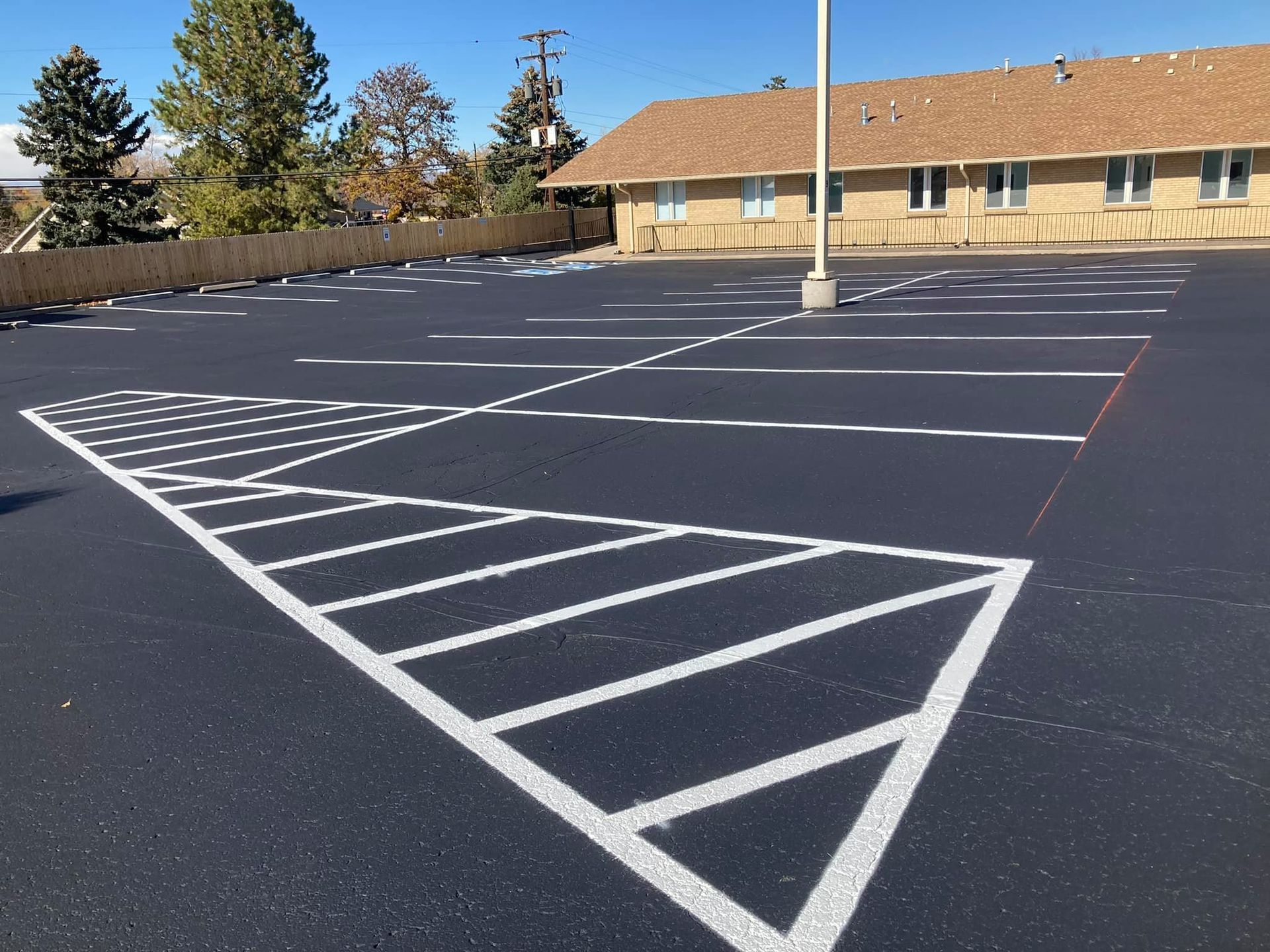 A parking lot with a handicapped parking space in the middle