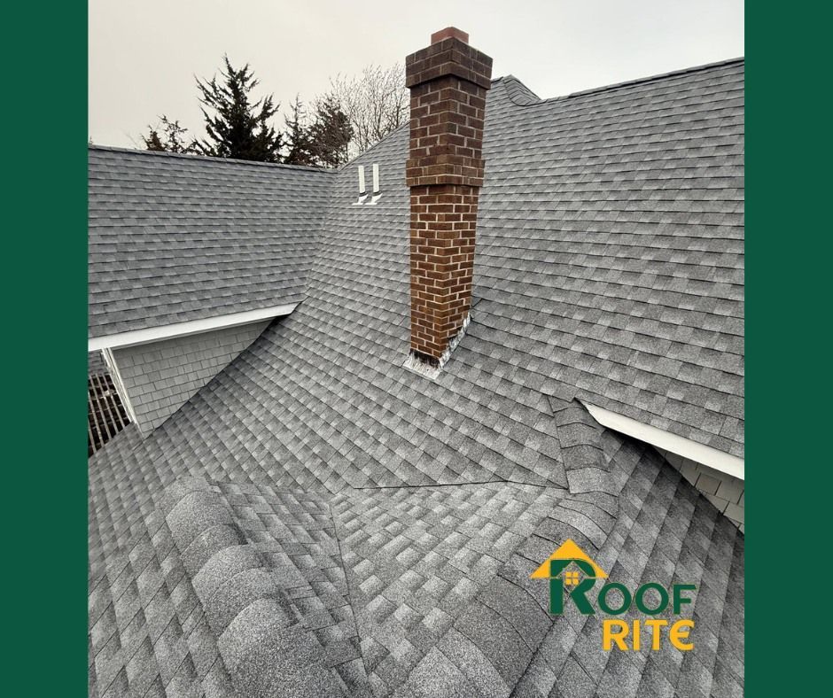 Gray shingle roof with brick chimney, the 