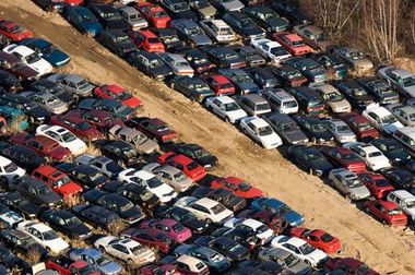 A lot of cars are parked in a lot.