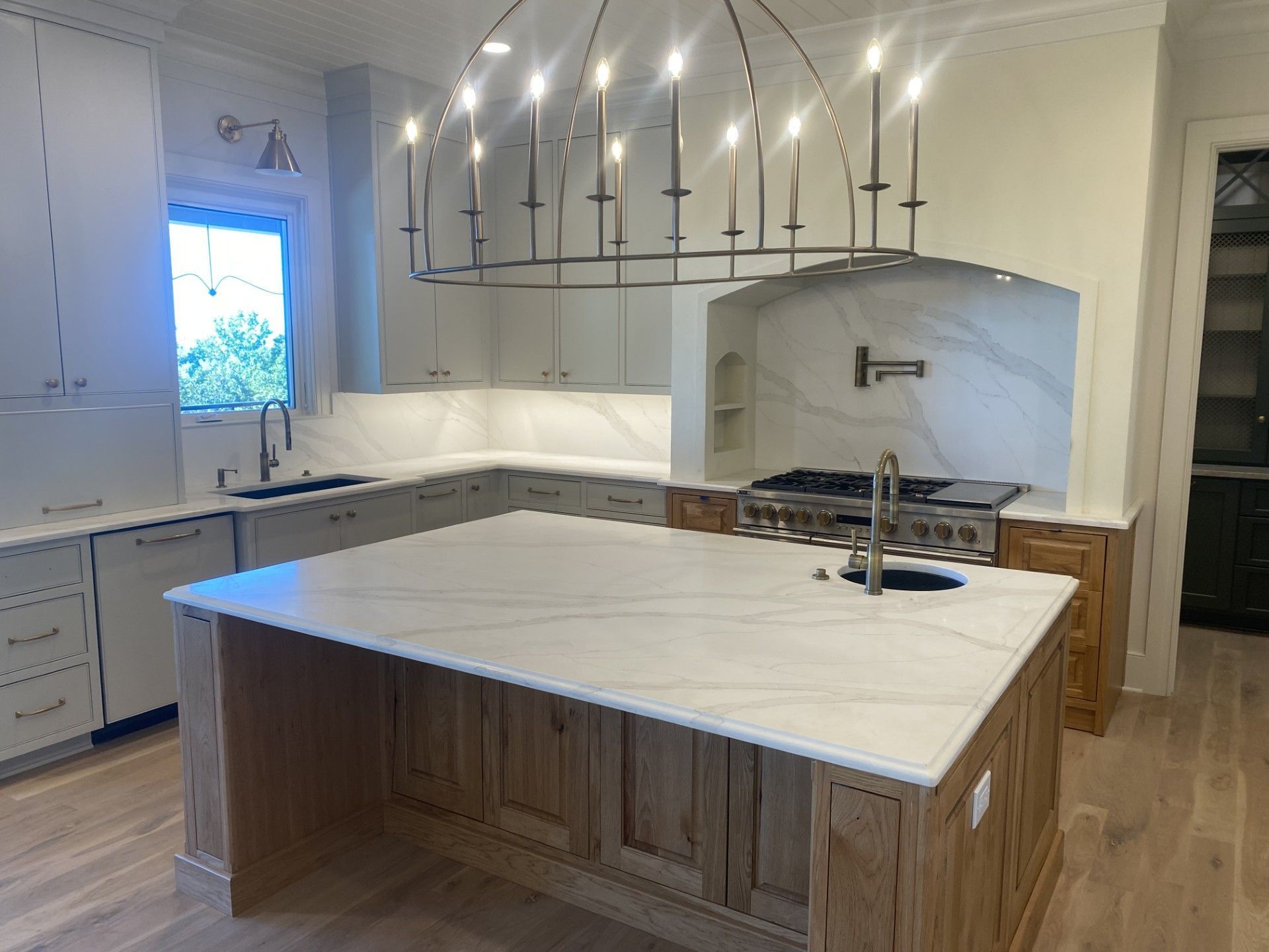 There is a large island in the middle of the kitchen.