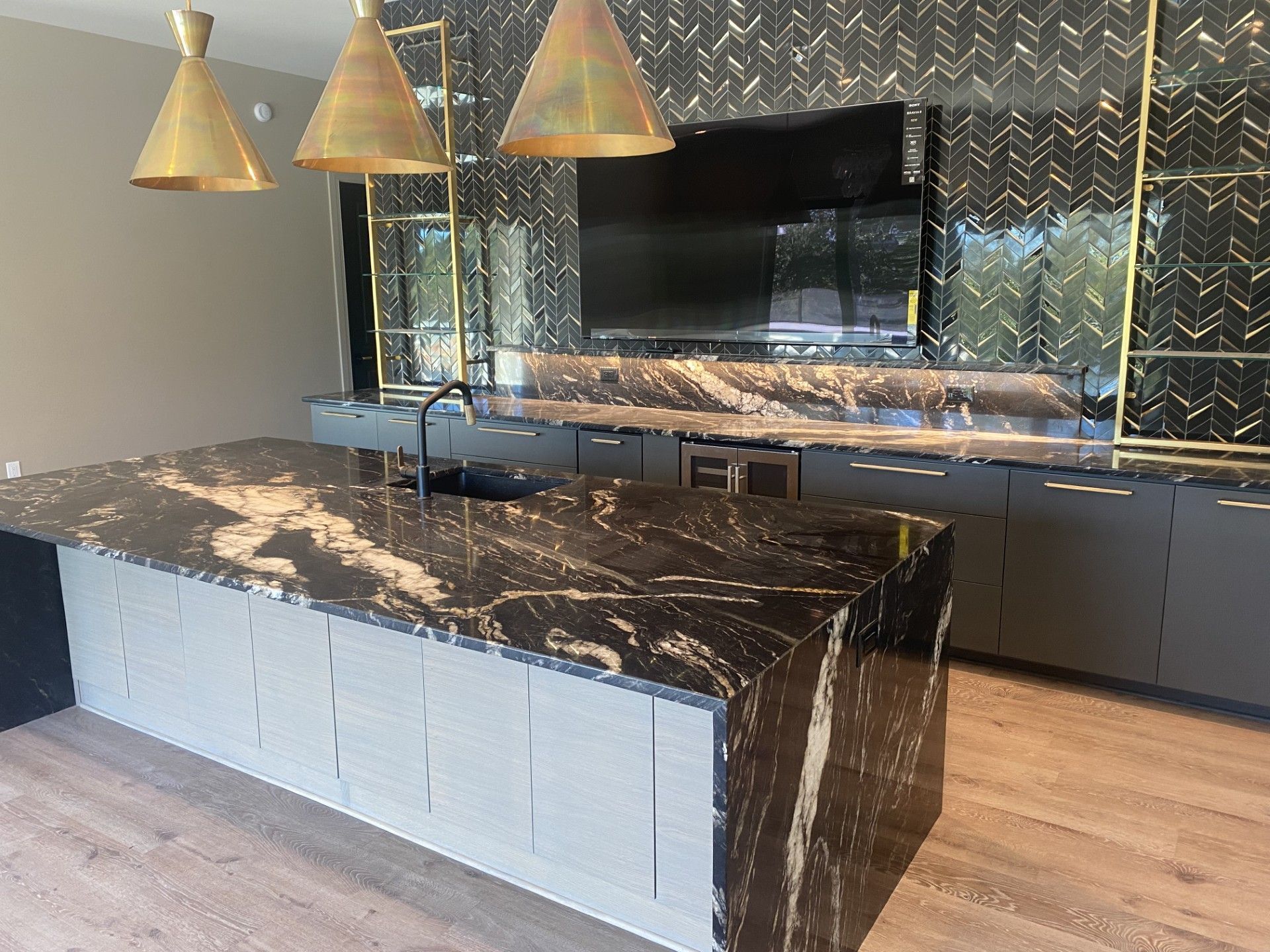 There is a large island in the middle of the kitchen.