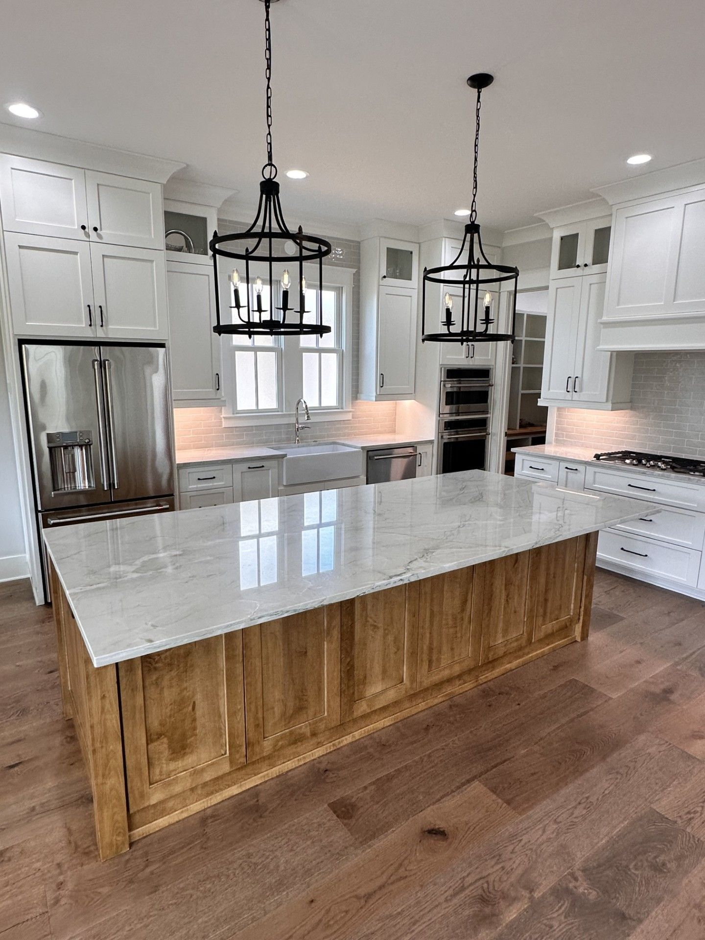 There is a large island in the middle of the kitchen.