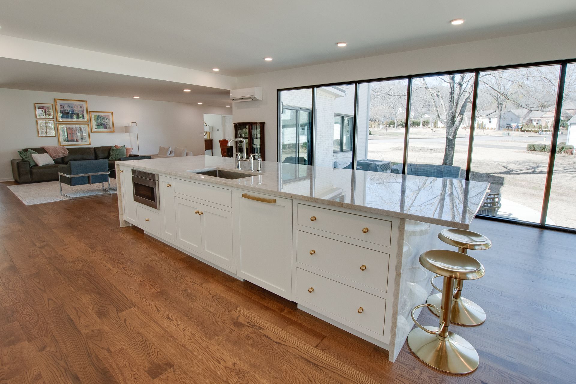 A kitchen with a large island in the middle of the room.