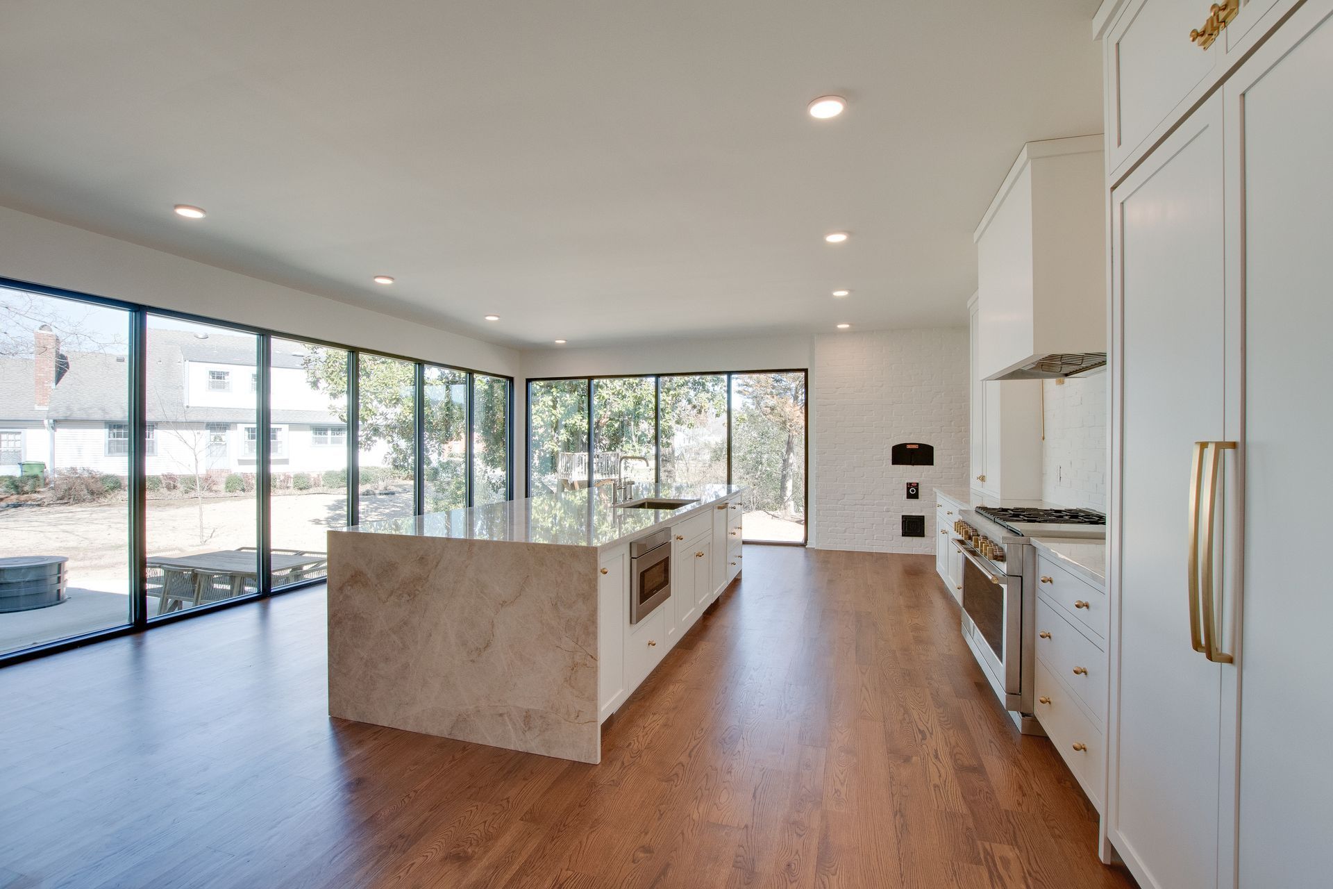There is a large island in the middle of the kitchen.