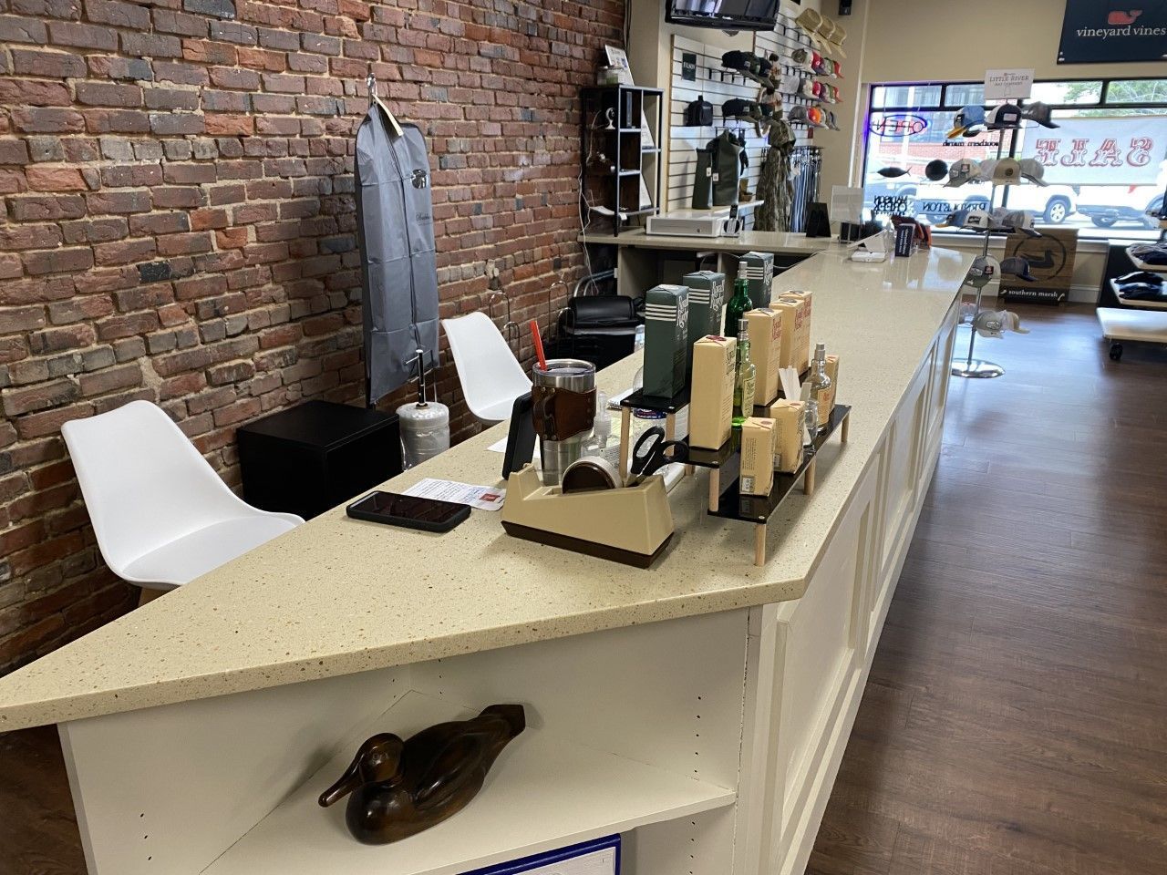 A long counter in a store with a duck on it.