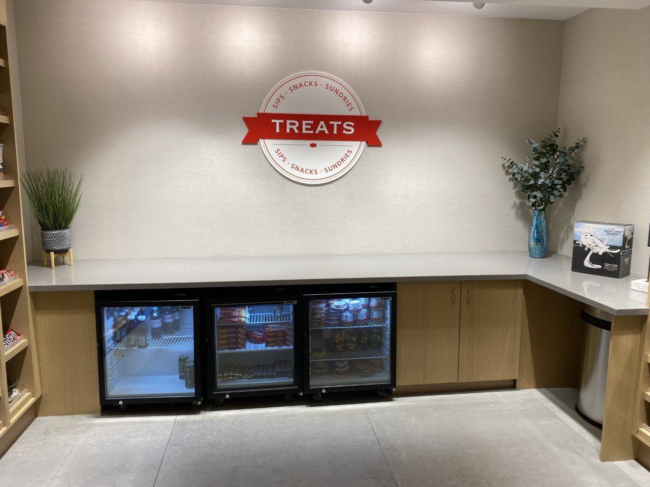 A room with a sign on the wall that says treats
