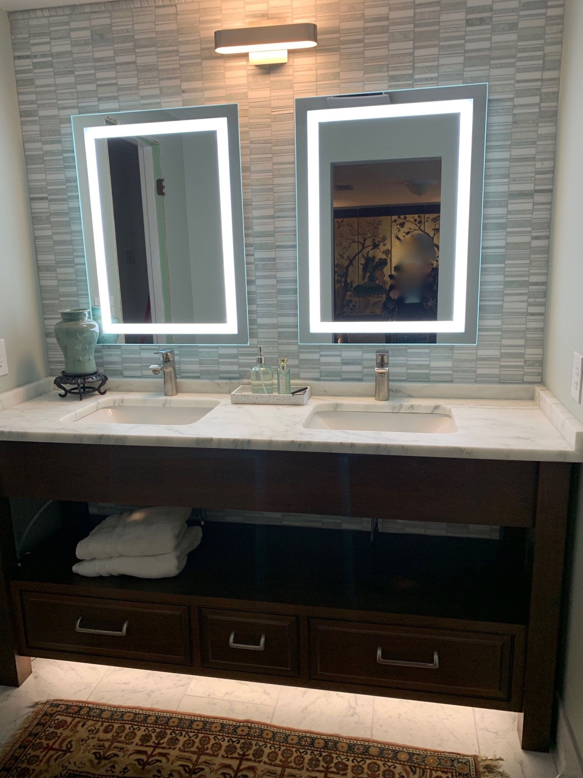 A bathroom with two sinks and two mirrors.