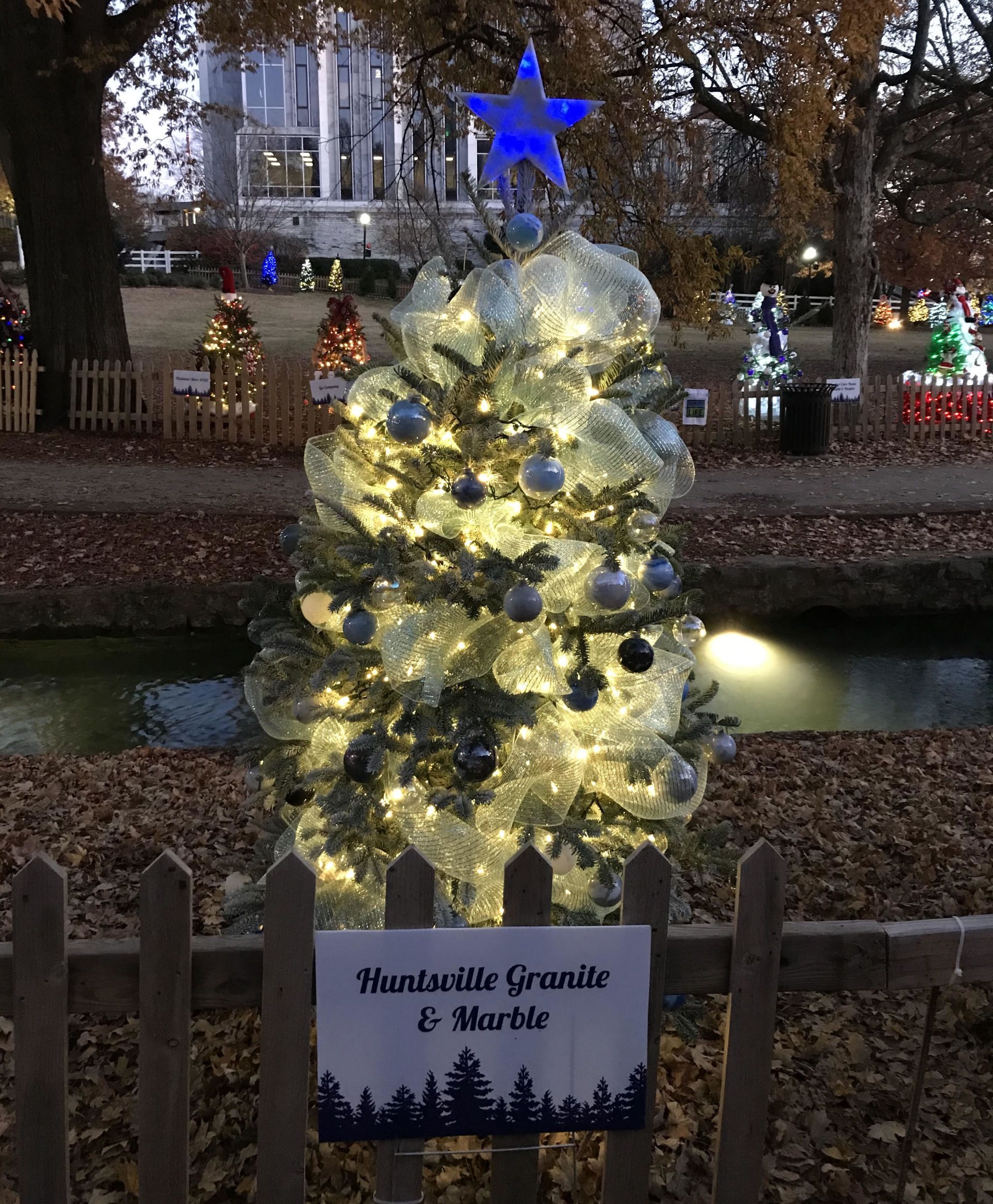 A christmas tree made out of plastic bottles with a star on top