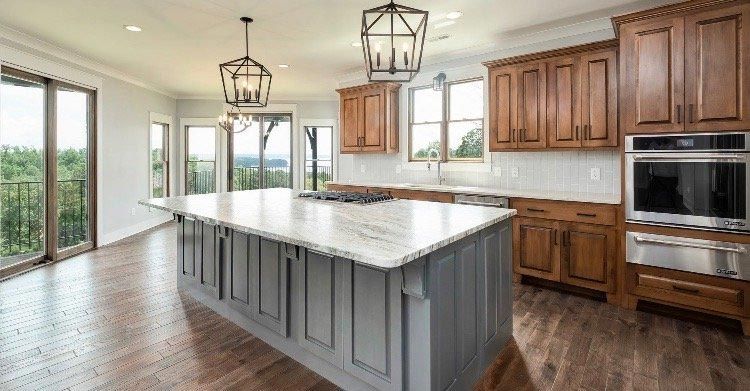 There is a large island in the middle of the kitchen.