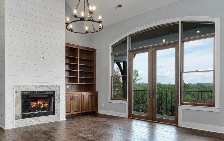 There is a fireplace in the middle of the room.