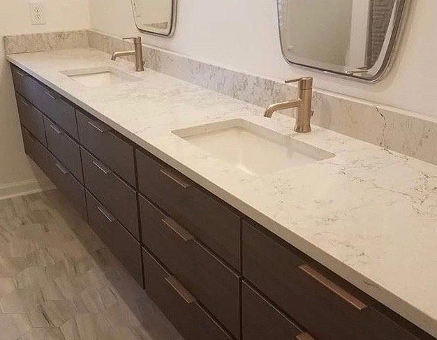 A bathroom with two sinks and two mirrors.
