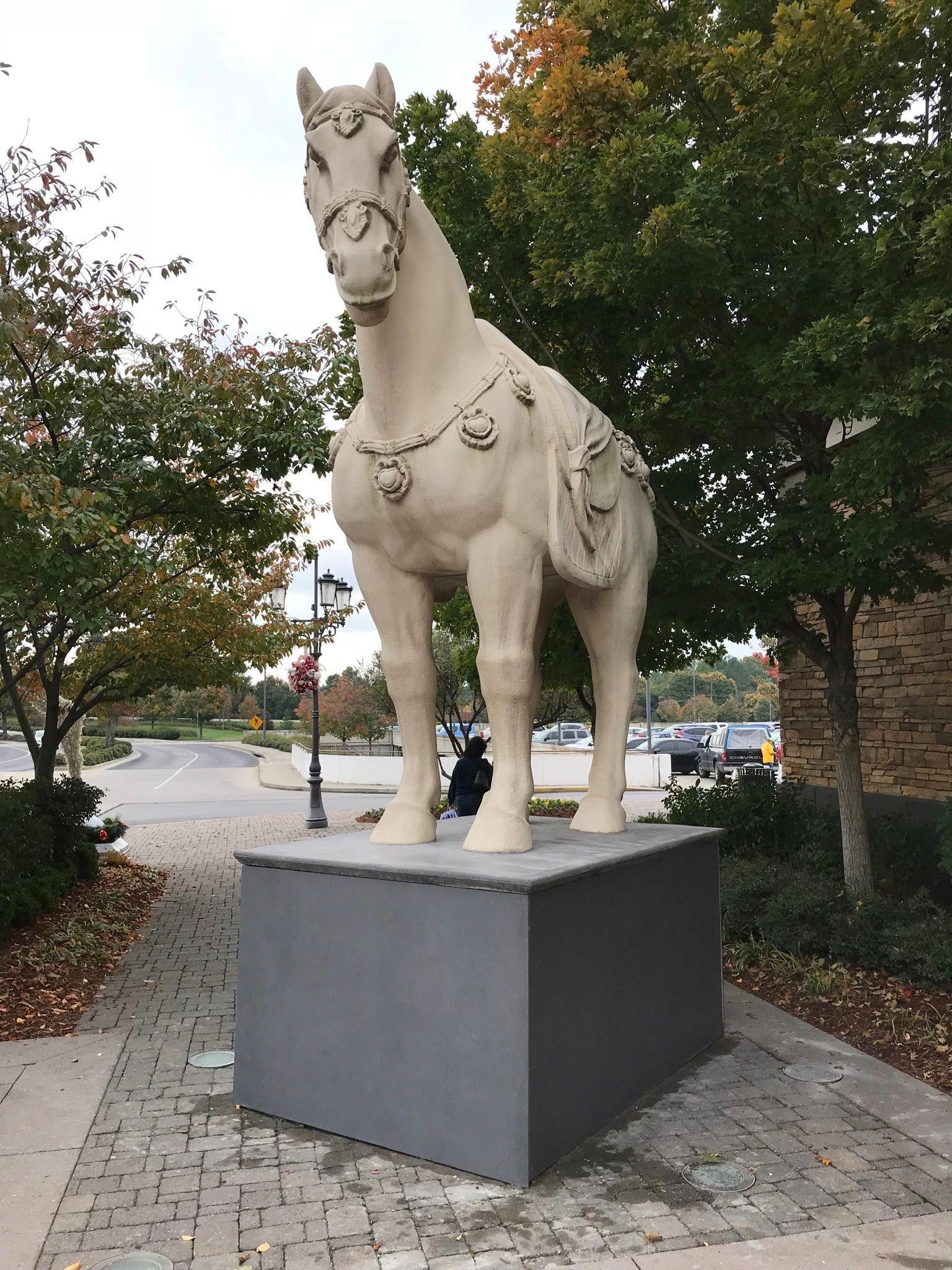 A statue of a horse standing on a pedestal