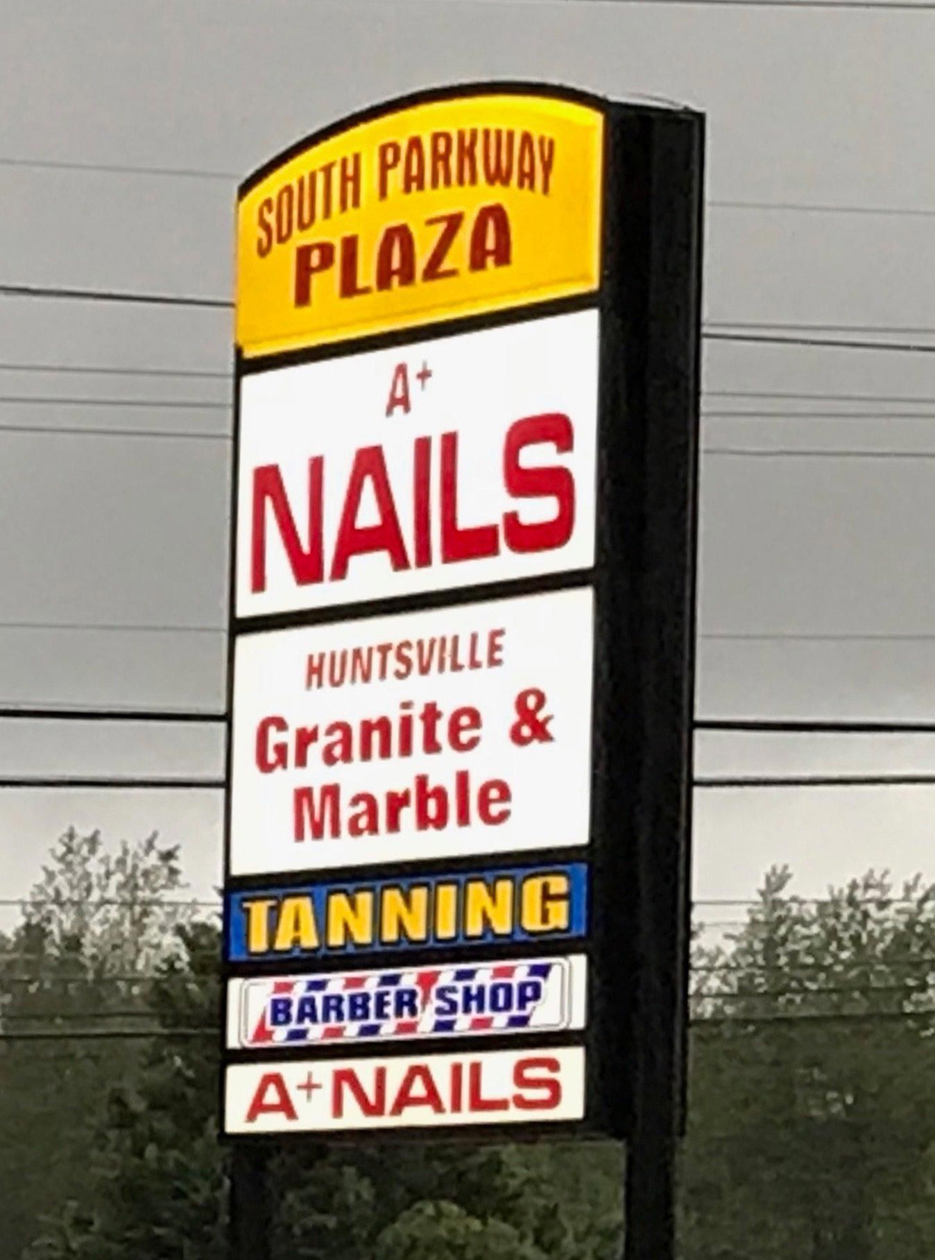 A sign for south parkway plaza a + nails