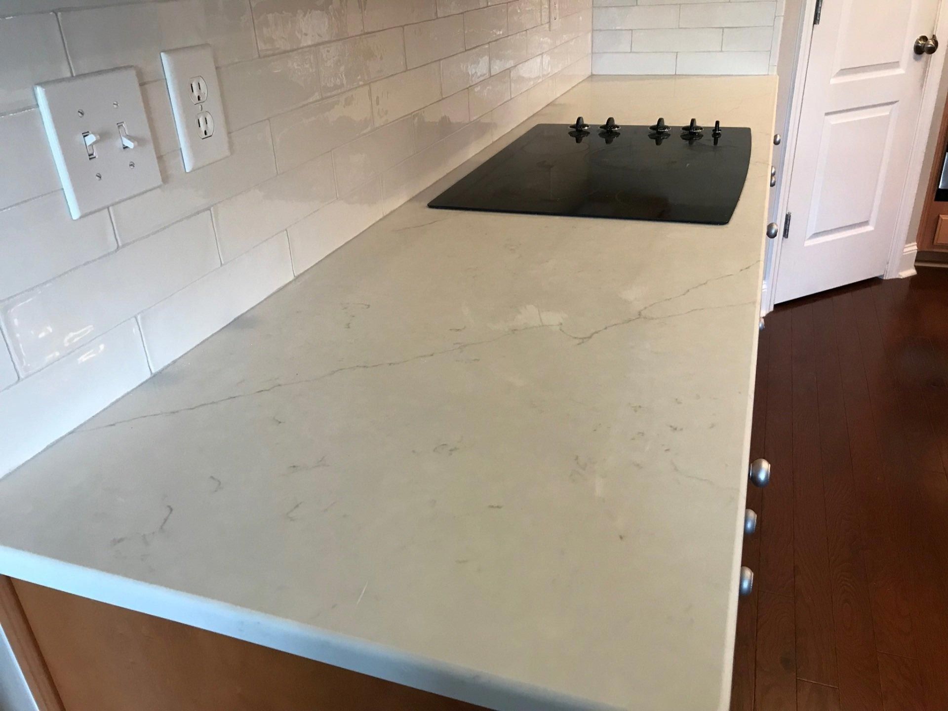 A kitchen counter with a stove top oven on it.