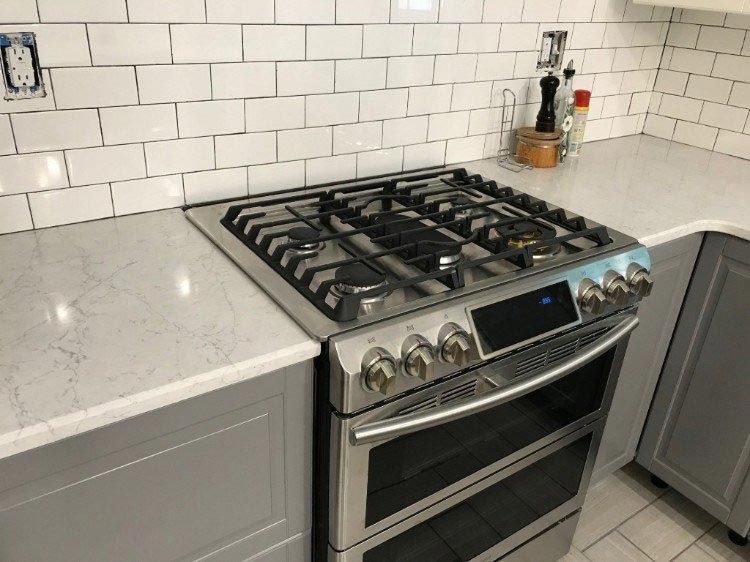 A stove top oven is sitting on top of a kitchen counter.
