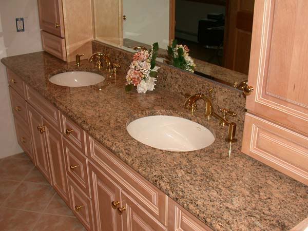 A bathroom with two sinks and a mirror