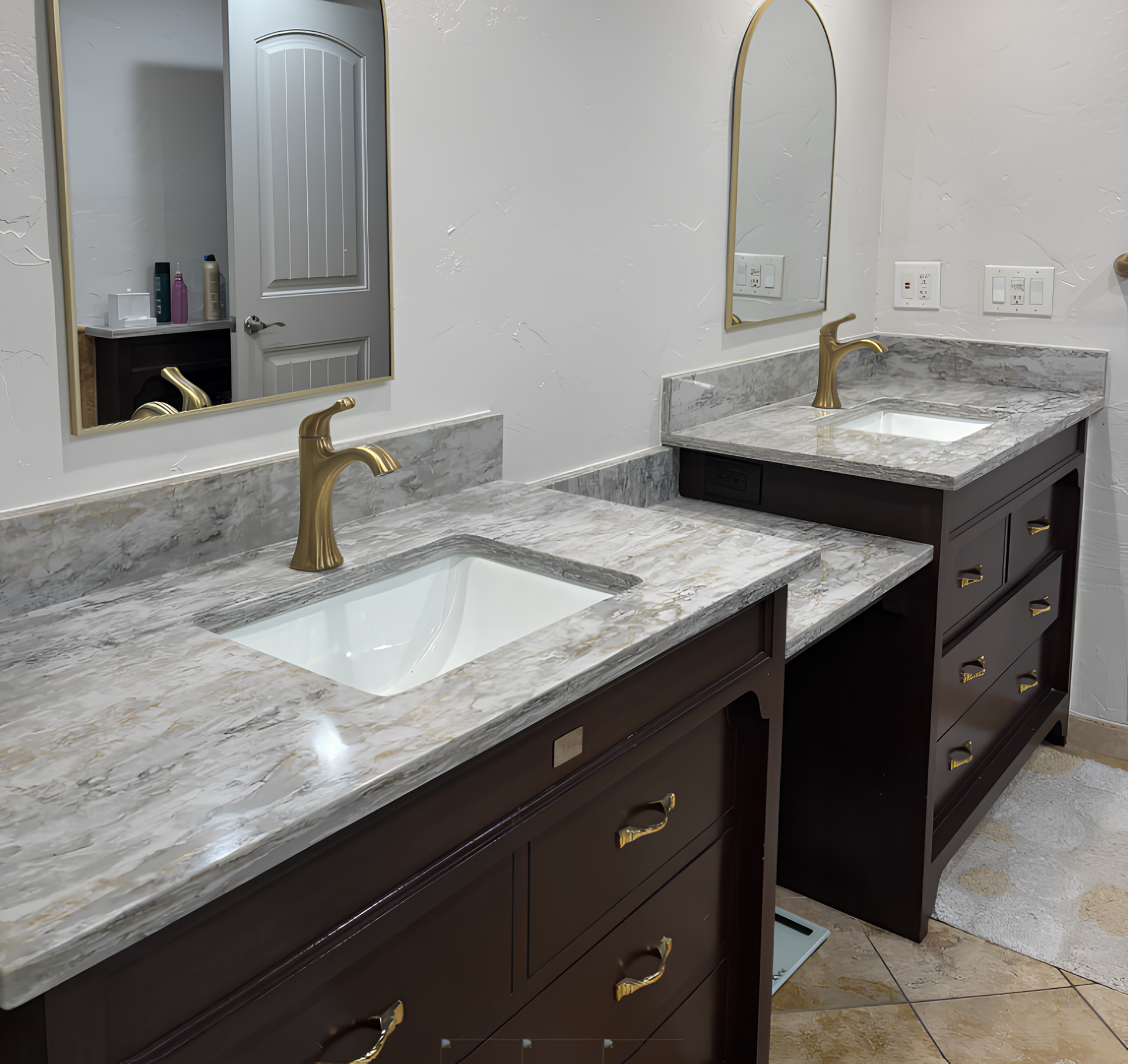 White bathroom vanity with granite countertop and dual sinks.