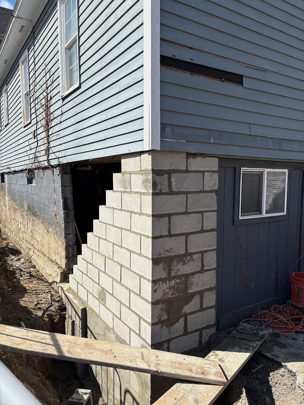 The corner of a house is being built with bricks.