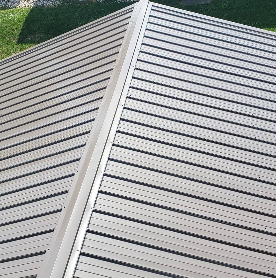 A close up of a metal roof with black stripes