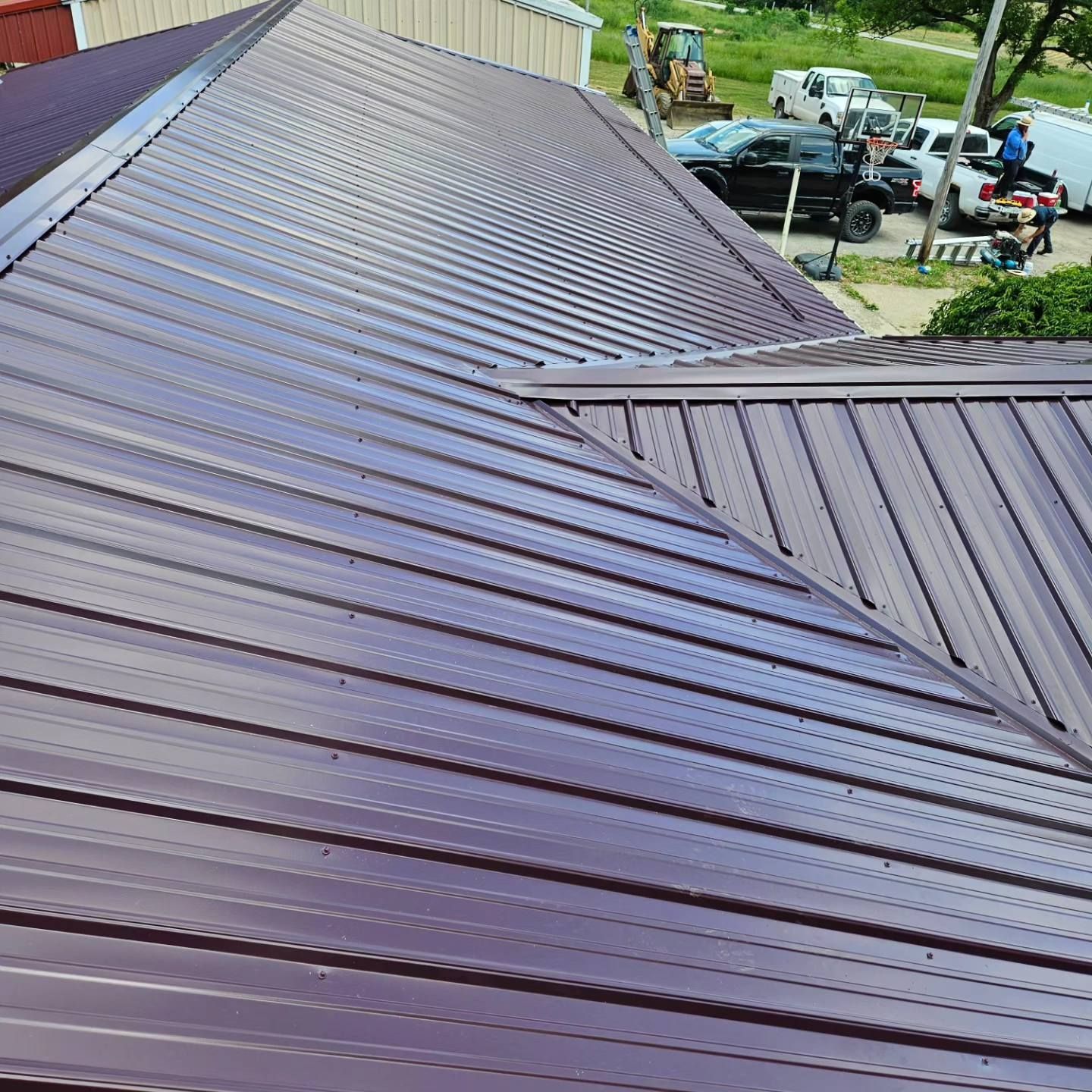 A close up of a purple metal roof on a house.