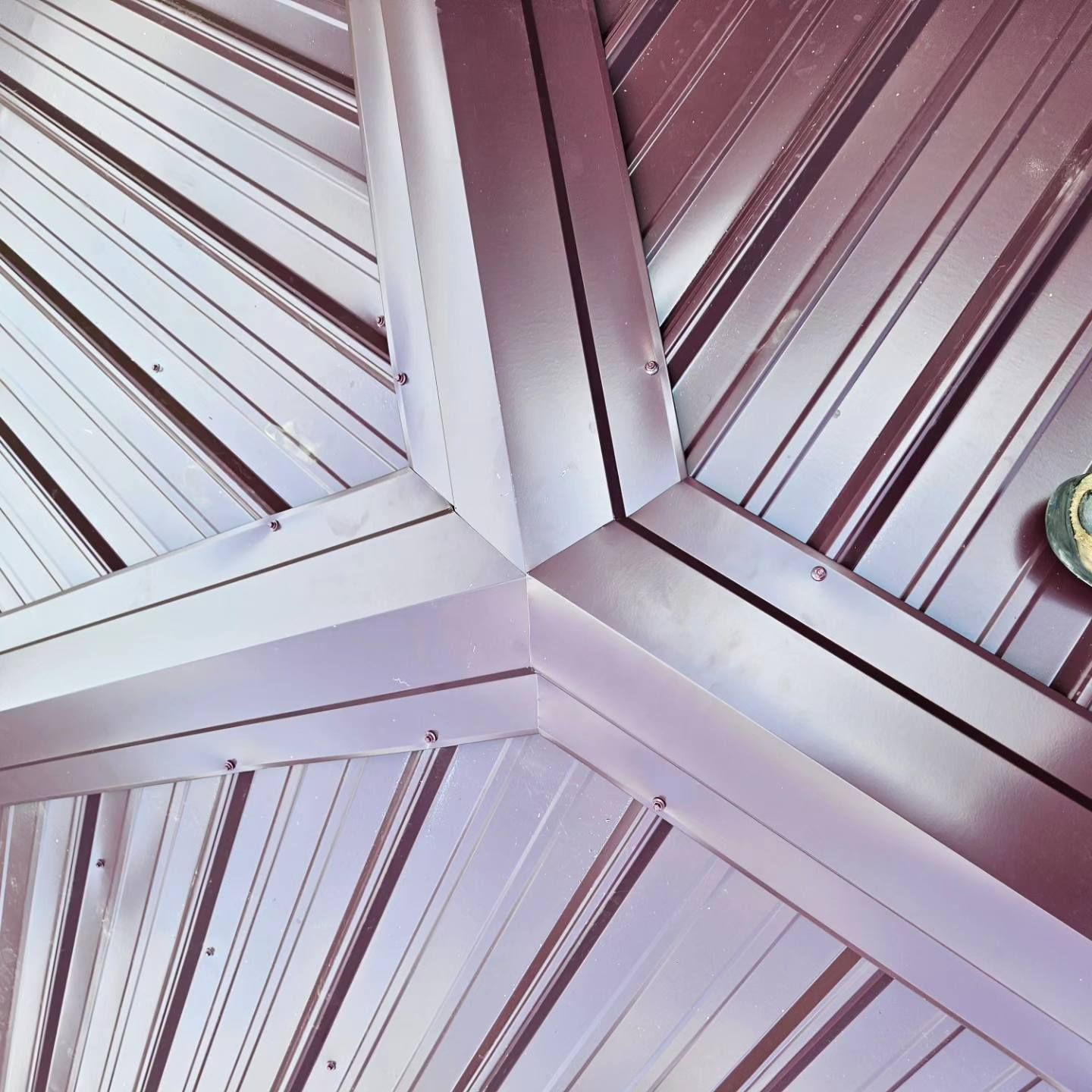 A close up of a metal ceiling that looks like a star