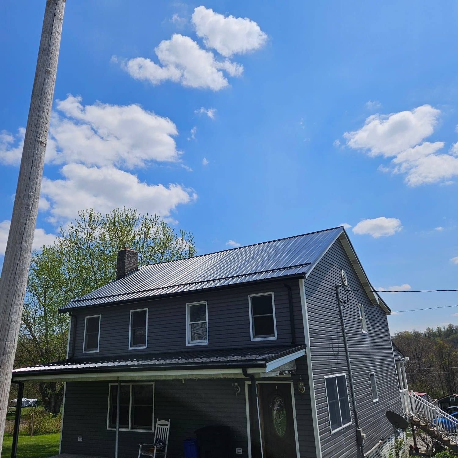 A house with a solar panel on the roof
