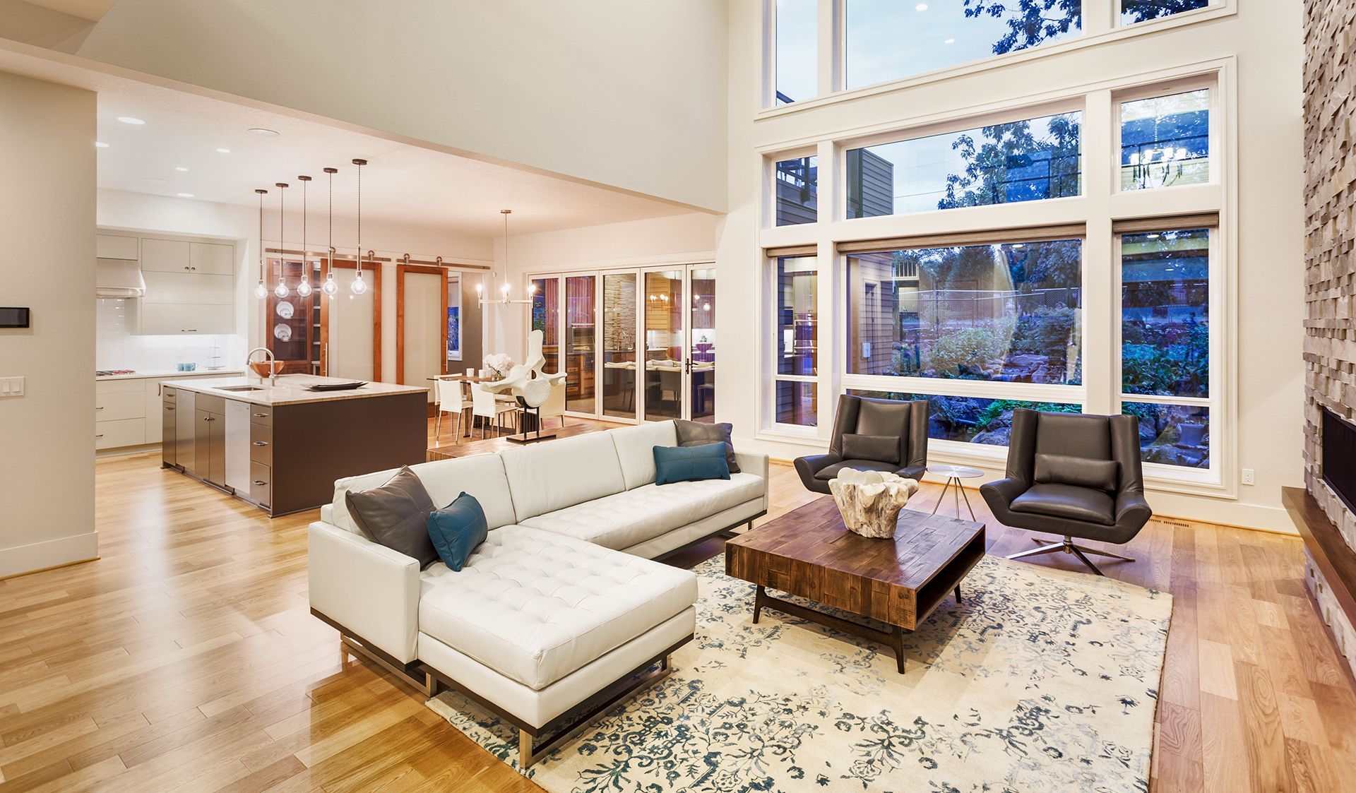 Air conditioning unit sitting on rocks next to a building.