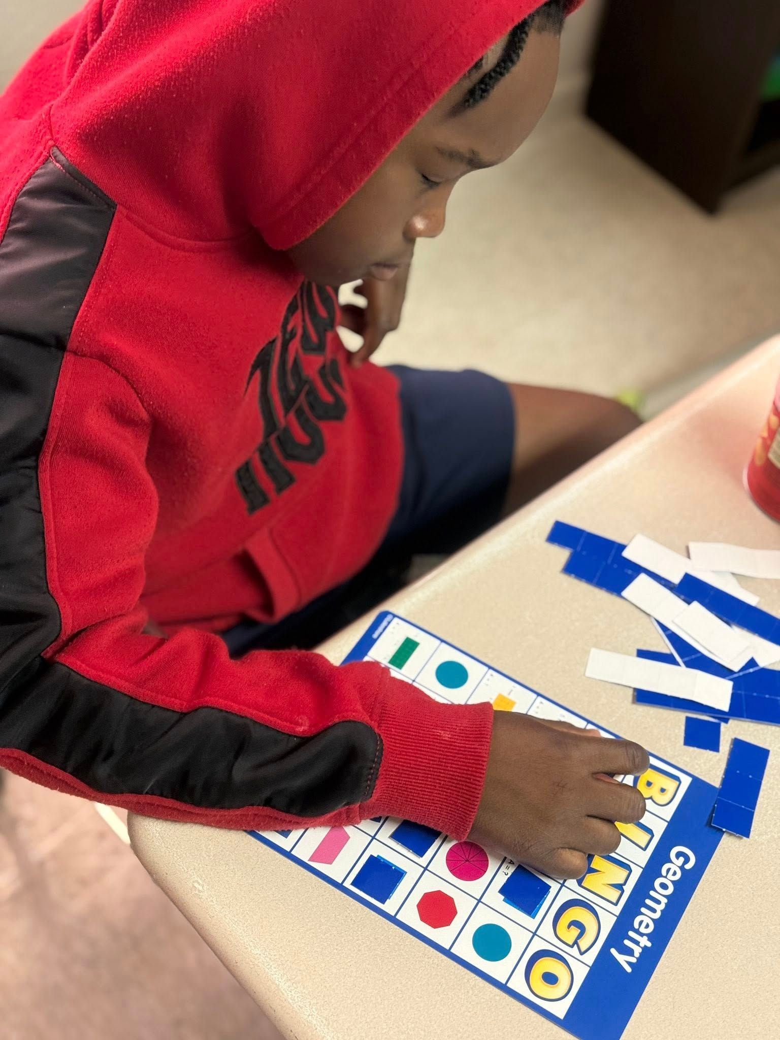 Person in red hoodie playing 