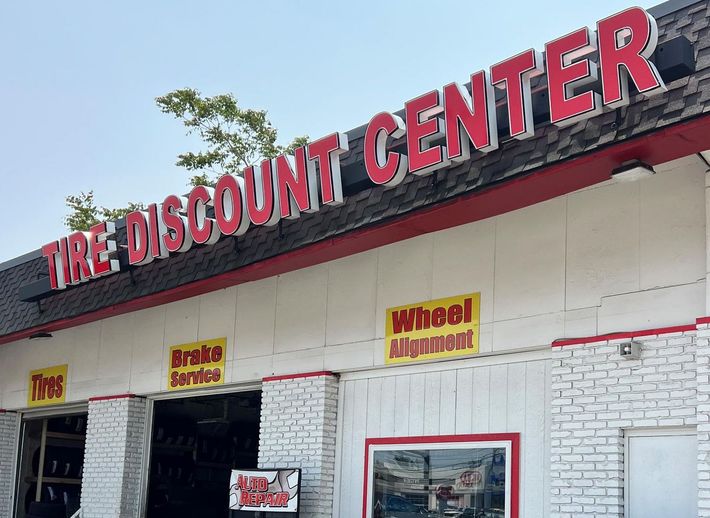 A tire discount center is located in a brick building