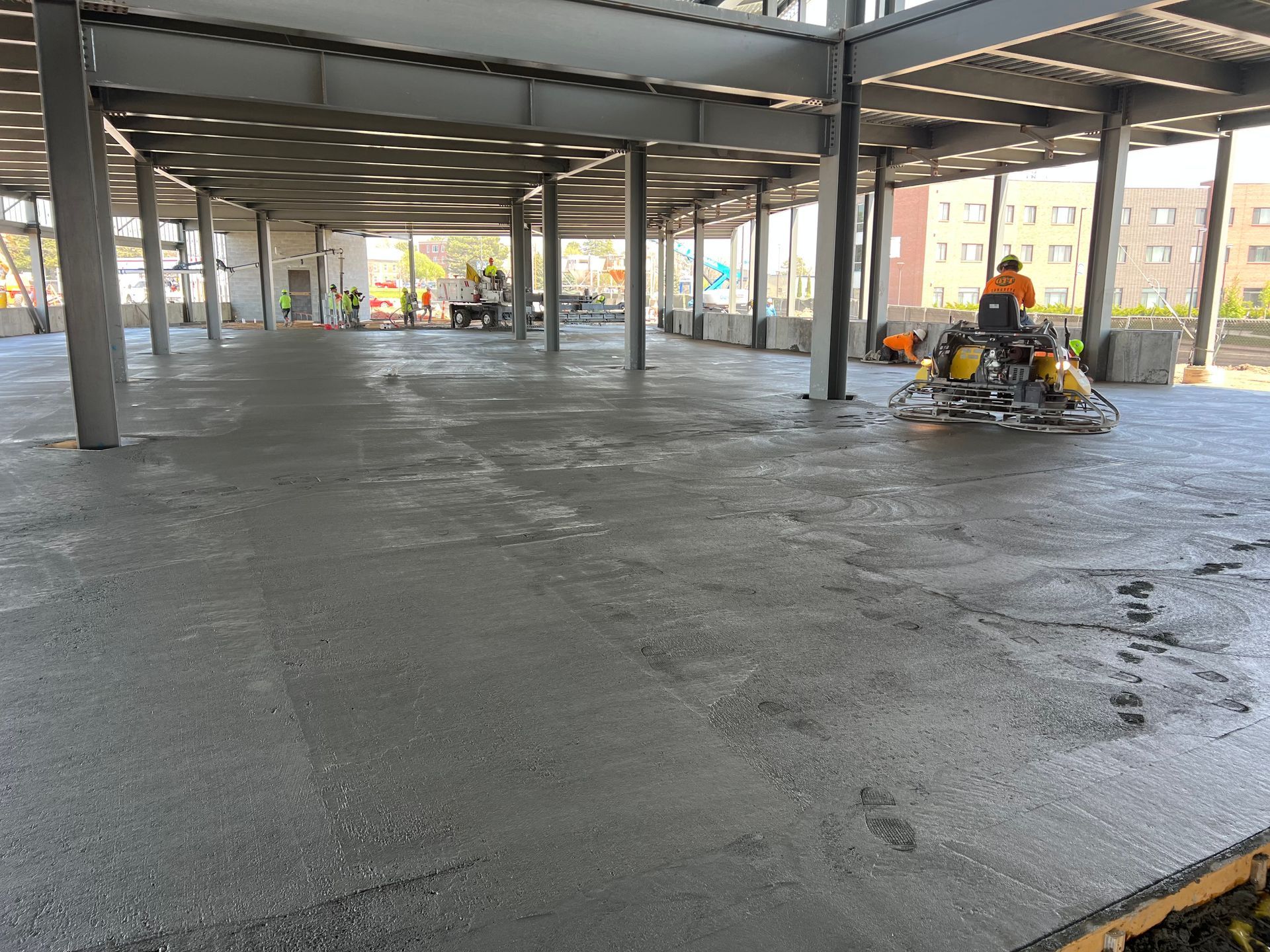 A man is riding a machine on a concrete floor