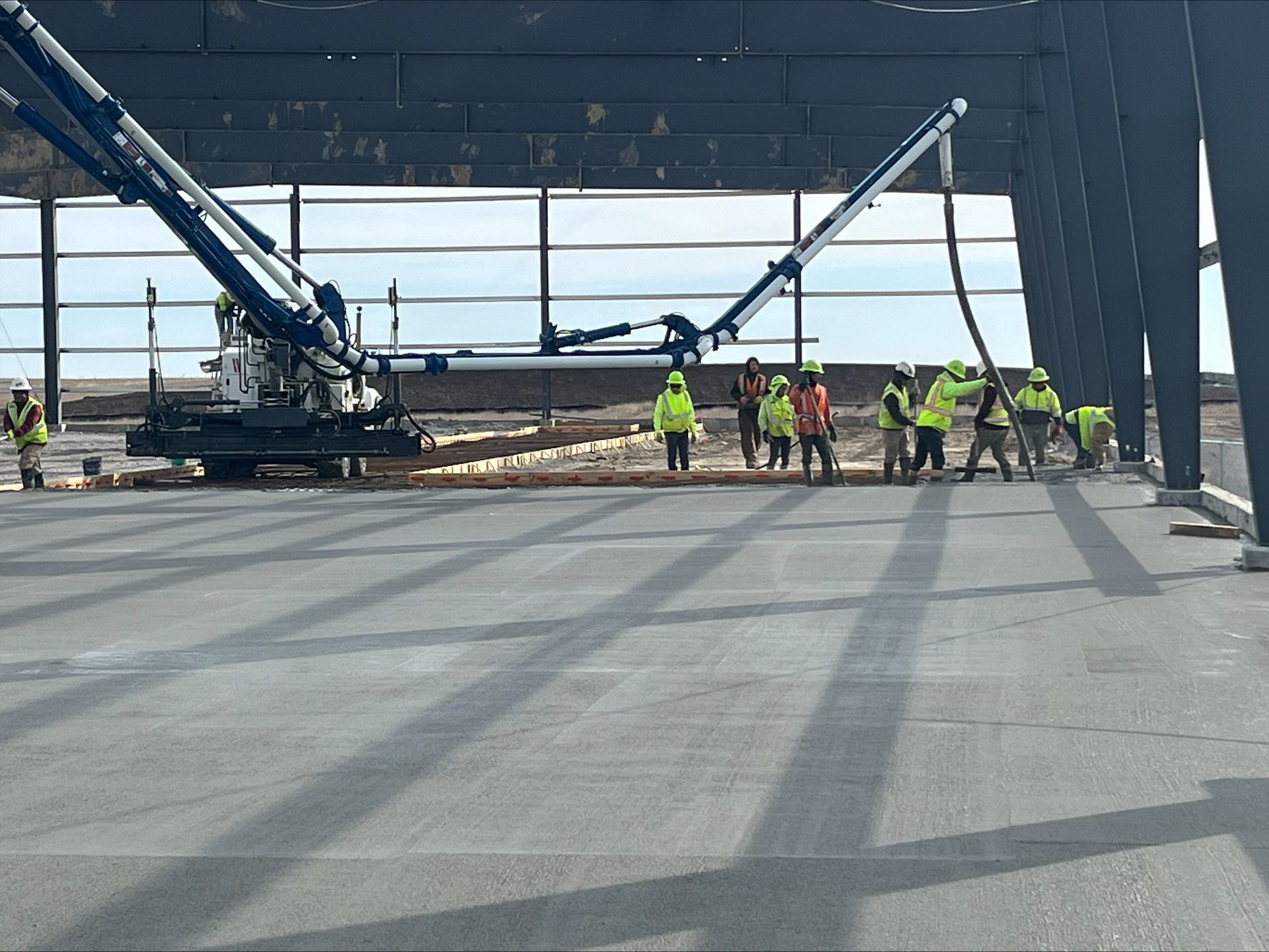 A group of construction workers are working on a building under construction